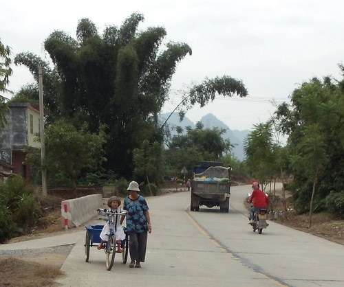 Grandmother and granddaughter go to the market.